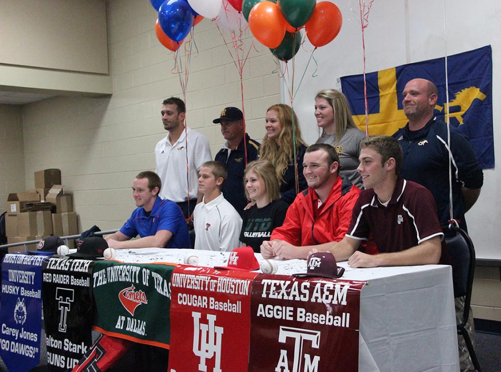 Carey Jones, Dalton Stark, Aimee Wilhelm, Derek Dickerson, and Corbin Martin sigh letters of intent to play college basketball.