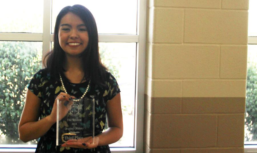 Senior Faith Wright poses with her award.