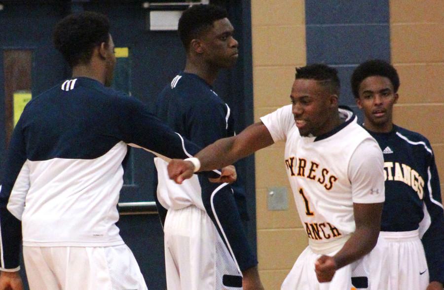 The basketball team plays around before the game.