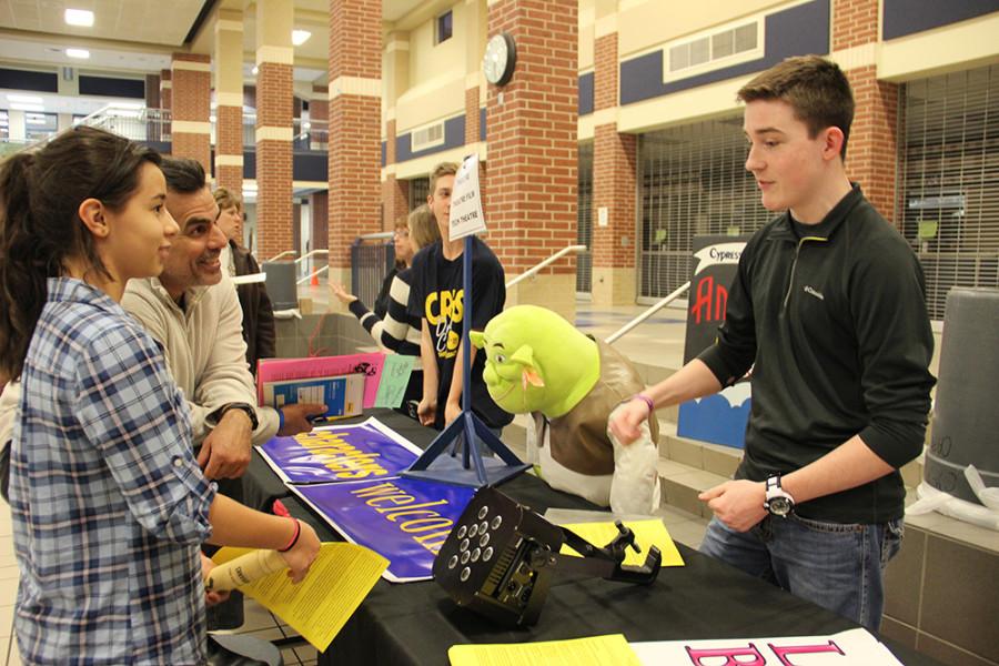 An underclassman visits with the Theatre booth.