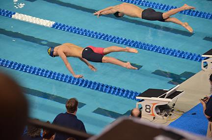 Sophomore Sean Morey dives into the water at the UIL Swimming and Diving State Meet. 