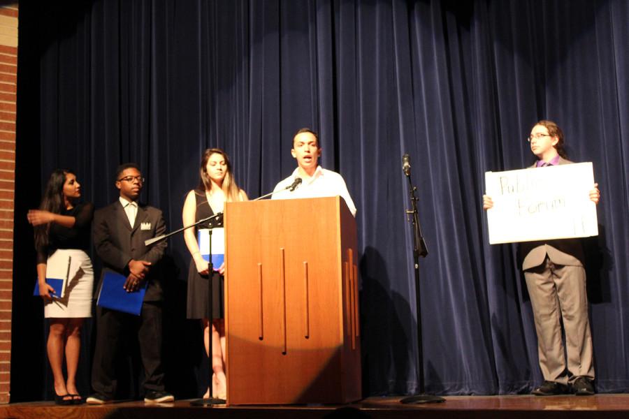 Members of the speech and debate team demonstrate what debate is during the second period assembly.