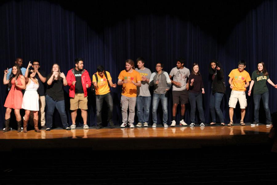 The performers gather on stage to end the night.