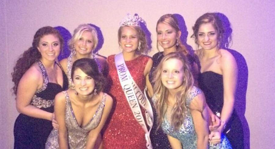 The Prom Queen Alexis Tarpley poses with friends after receiving her crown.