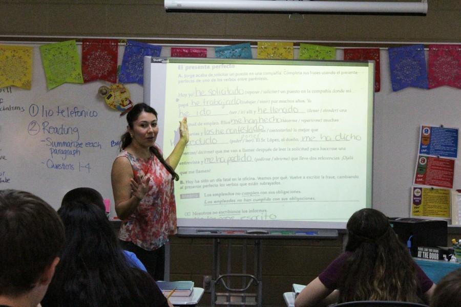 Rodriguez goes over a worksheet with her class.