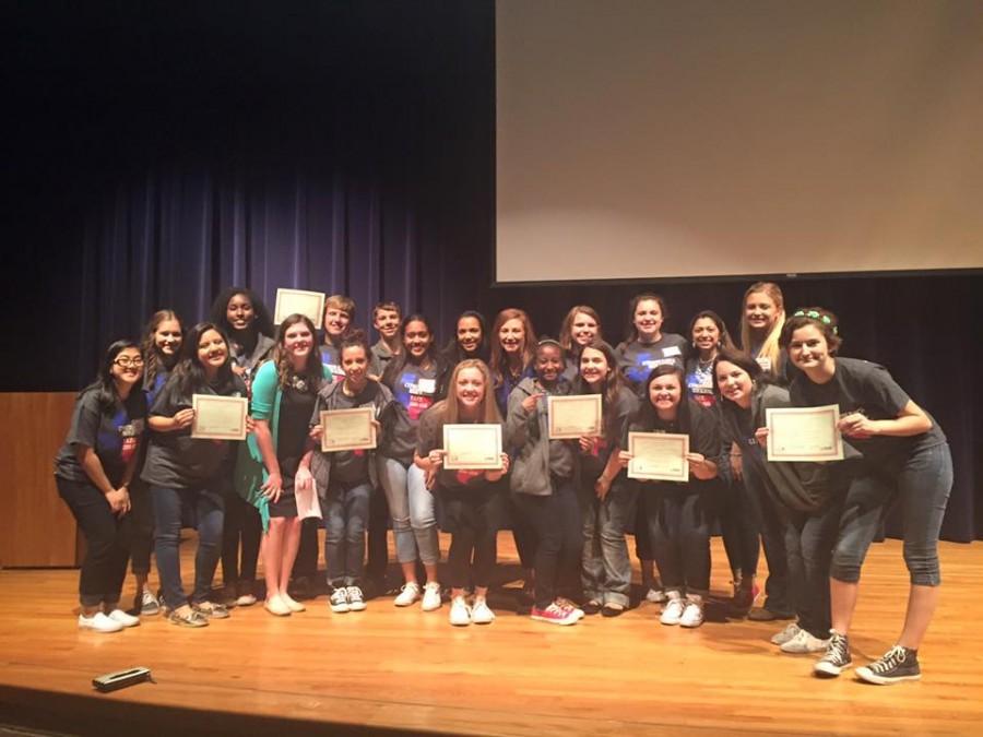 The advancing TAFE students pose with their certificates of achievement.