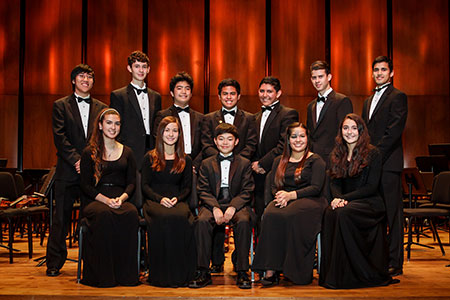 Canterbury (back row, far right) and Lawton (front row, second from the left) are among the 12 CFISD students who play in the orchestra.