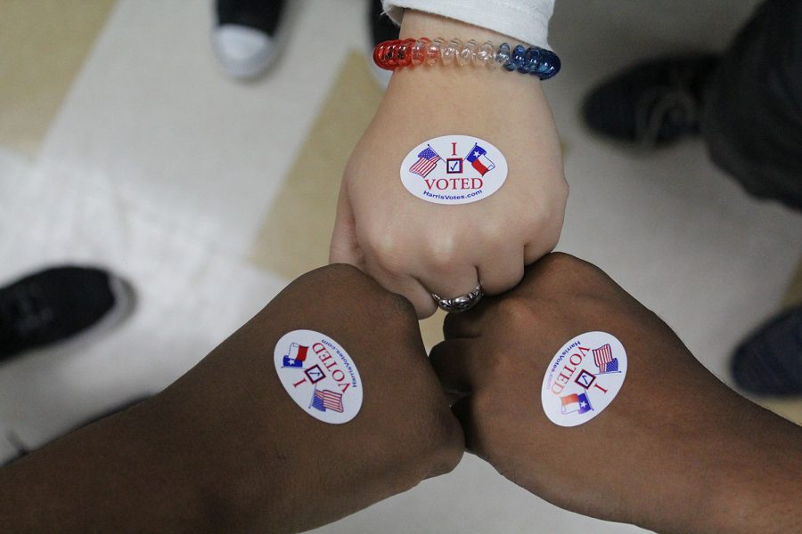 Students pose with their "I Voted" stickers.