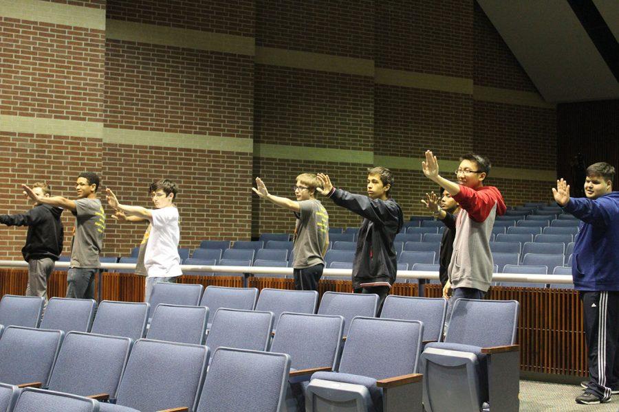 Choir practicing their dance moves prior to the Pop Show opening night. 