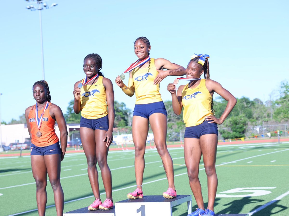 Celeste Robinson posing at a track meet after winning first place on April 4, 2024.