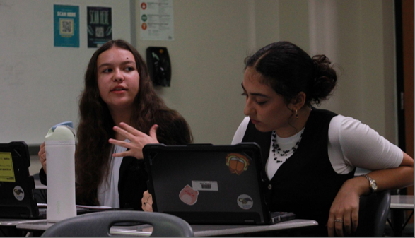 Junior Kaiana Matos, left, with her partner sophomore Shahad Attar, right.