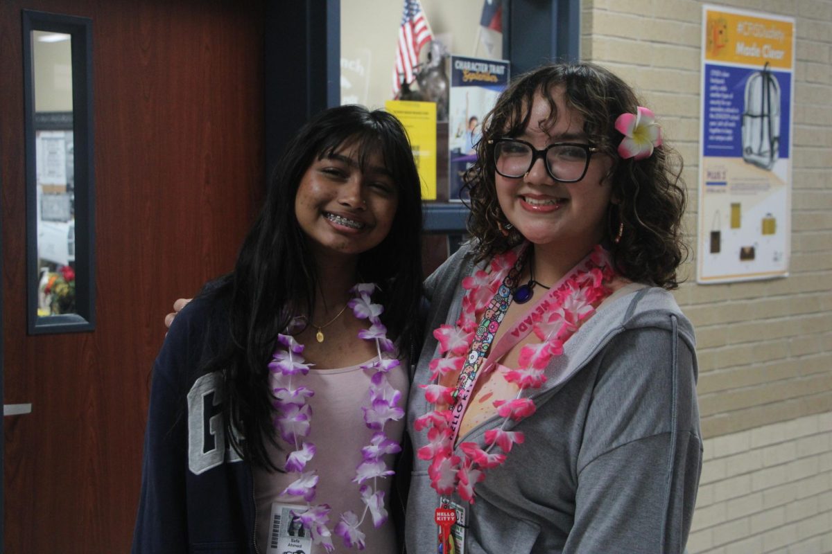 Freshman Safa Ahmed, left, and freshman Isabella Reyes, right pose during Homecoming Week.