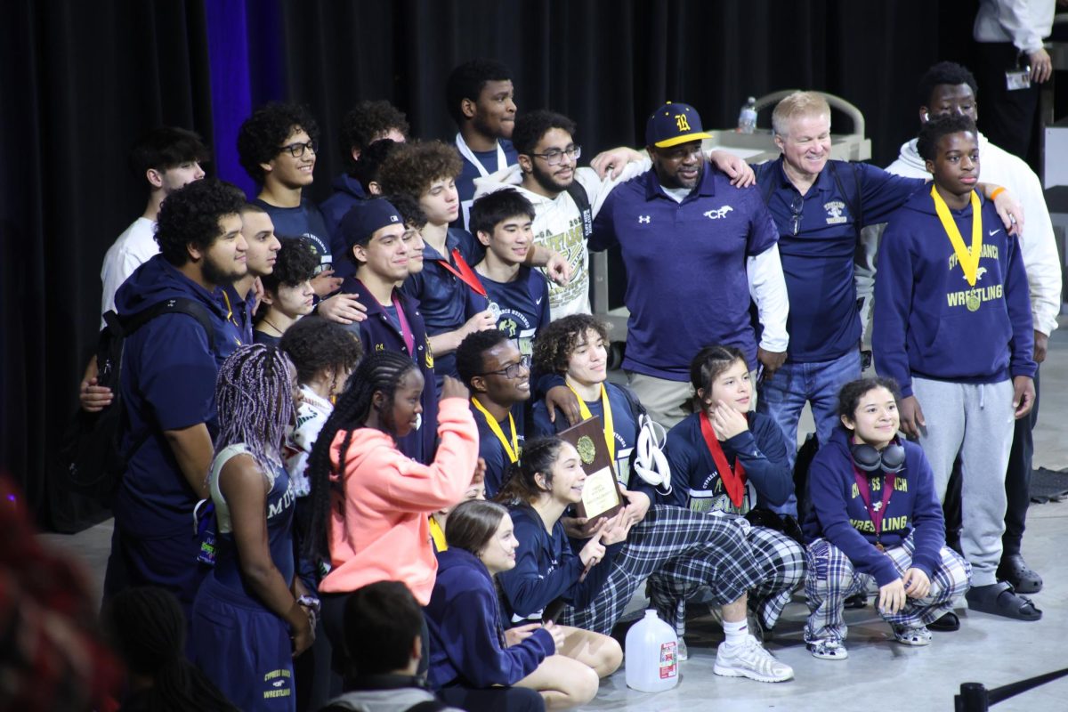 The Cypress Ranch wrestling team celebrates after winning district medals on Jan. 31.