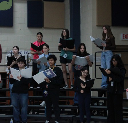 During 4 period, the Cy-Ranch
Choir practices for their upcoming
recital in the choir room,
highlighting their vocal performance
without technological use.